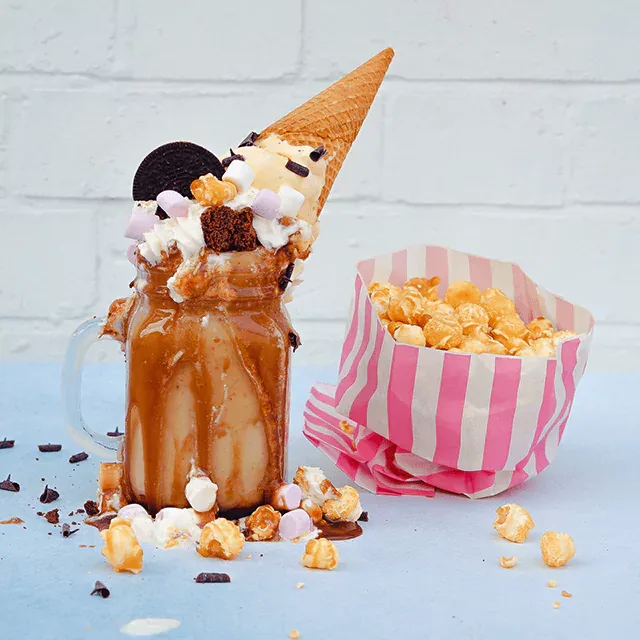 Decorated indulgent desert with sweet popcorn on the side