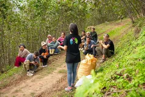 Ofi worker talking with farmers