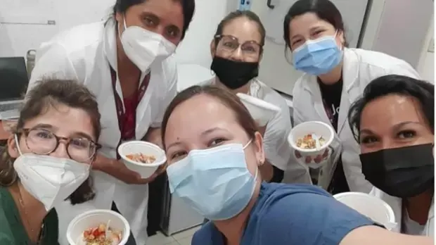 Selfie of a group of women holding a bowl of food