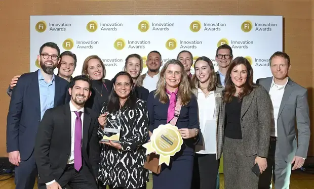 A group of people taking a photo for sustainability innovation award as winners of 2023