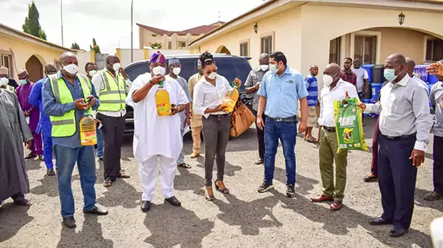 Group photo of a group of men in Nigeria receiving donations