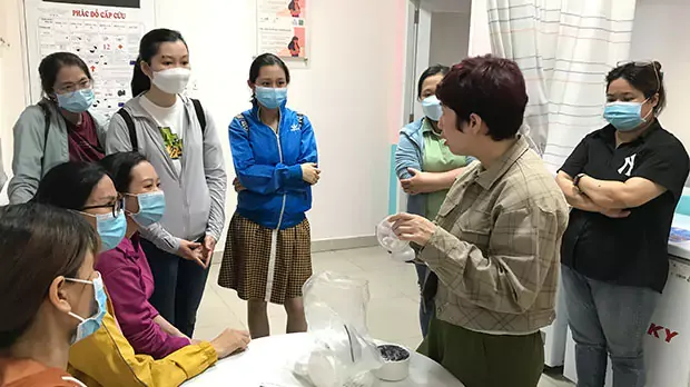 Women standing in a circle in nutrition program
