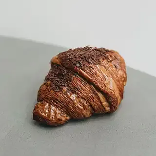 Ice-cream with caramel topped with crushed walnuts