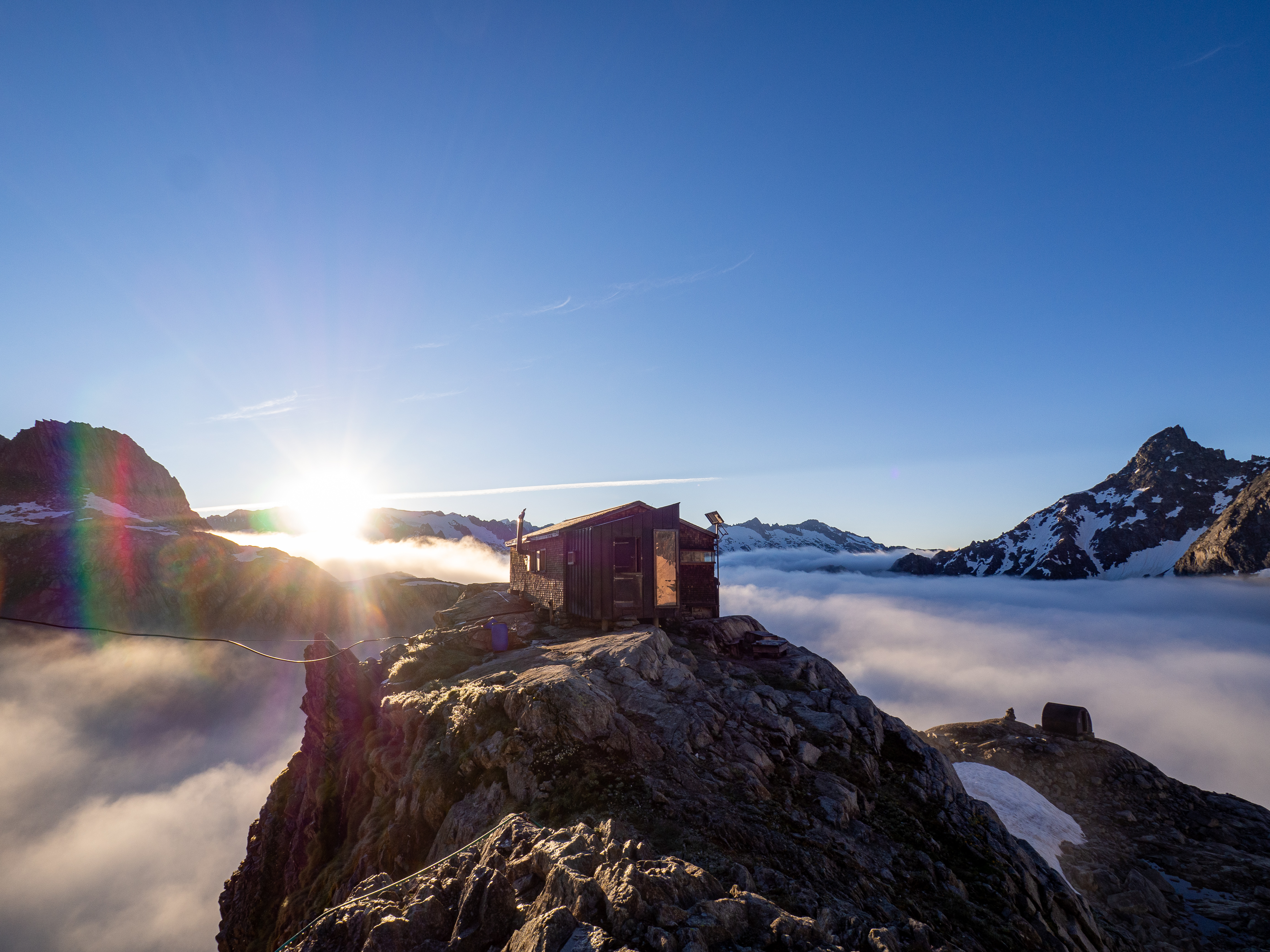 Sunrise with low-hanging clouds at the Gruebenhütte