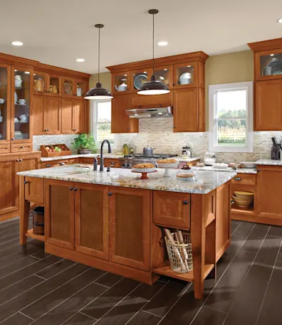 A lovely oak wood kitchen with a granite countertop