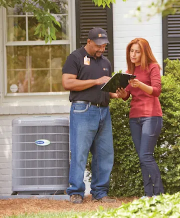 Home Depot pro and woman look at clipboard