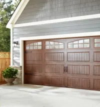 Brown wooden garage door with windows at the top; orange garage icon