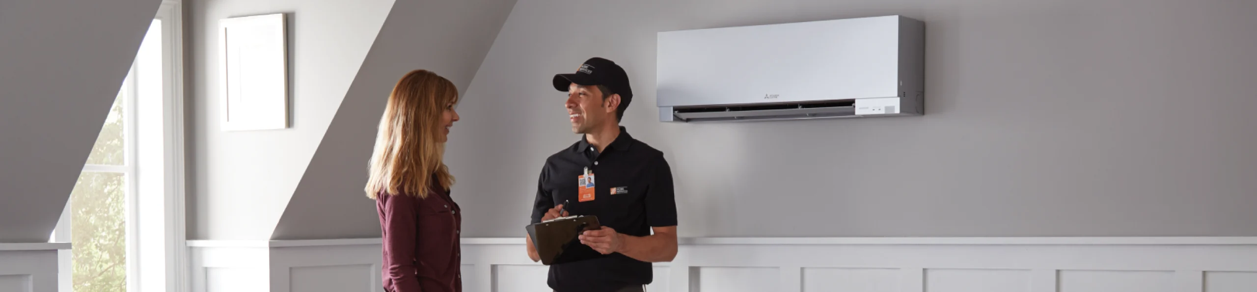 THD Service pro consulting a customer about their newly installed mini split unit