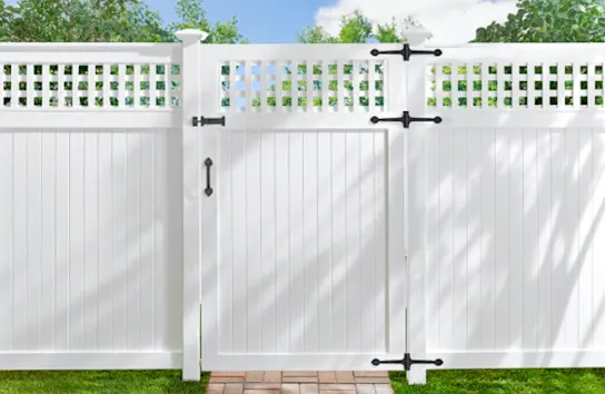 White fence on a green yard