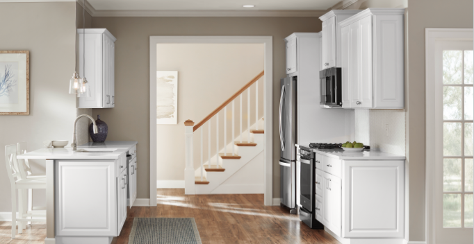 installed white cabinets in small galley kitchen
