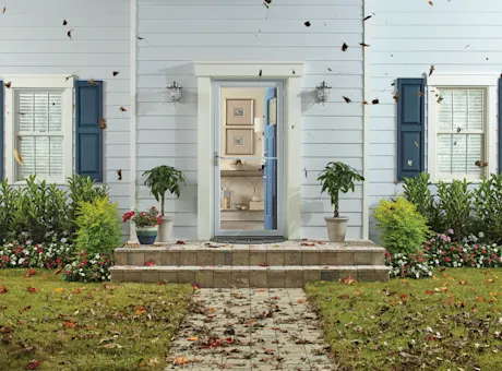 House exterior with open storm door 