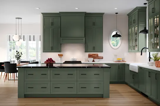 a kitchen with solid green cabinets