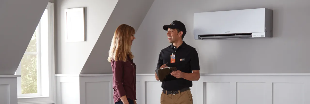 THD Service pro consulting a customer about their newly installed mini split unit