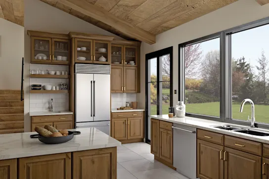 A gorgeous wood kitchen with satin brass hardware