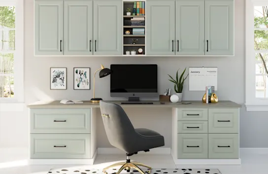 Bright and airy home office with sage colored cabinets