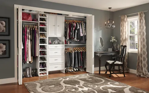 Bright and colorful bedroom with a simple closet with wall hung racks, shelves, and drawers