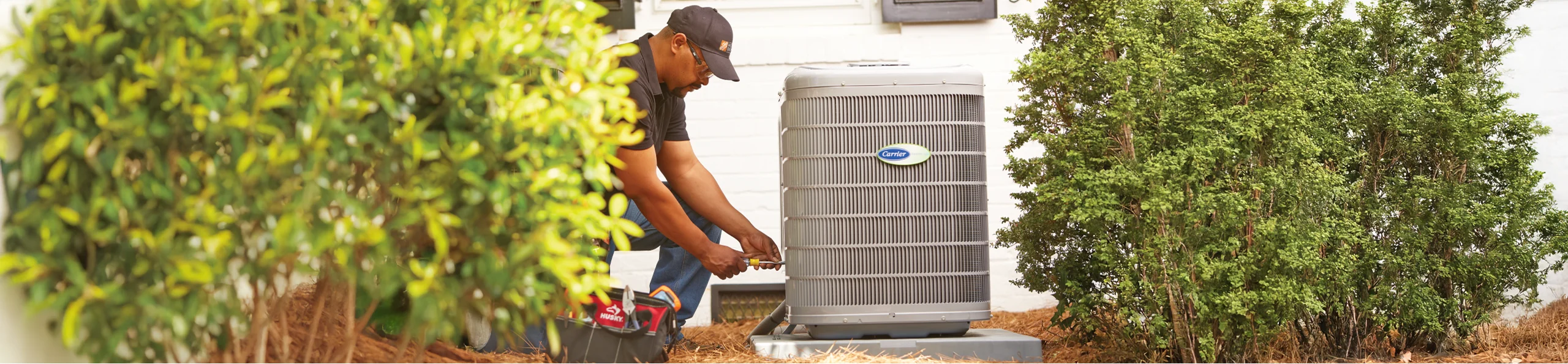 THD service provider repairing a customer's HVAC unit