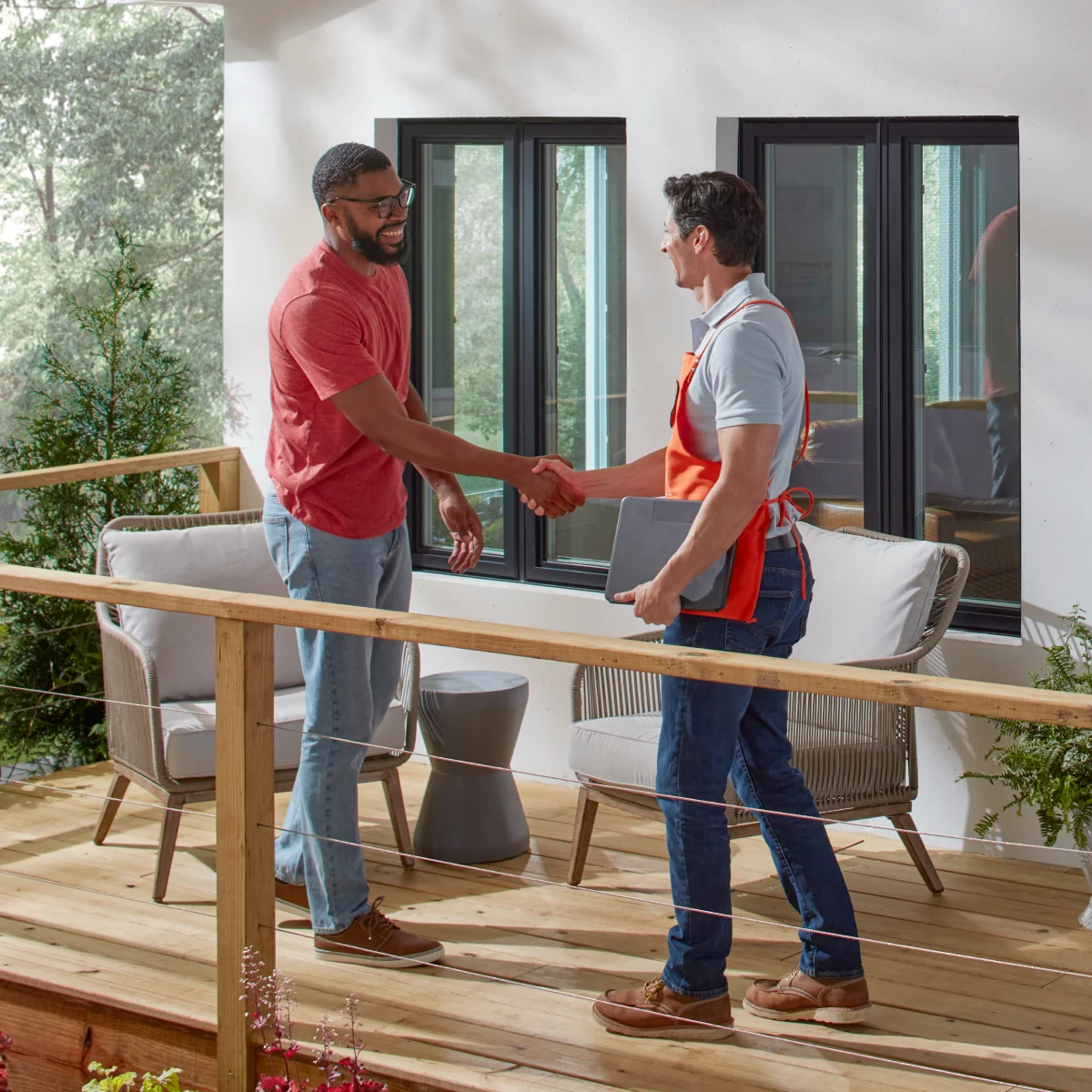A professional installer offering a hurricane shutter consult for a customer