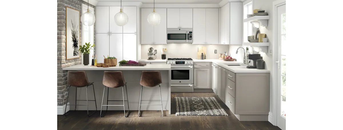 A white modern kitchen with flat panel cabinets