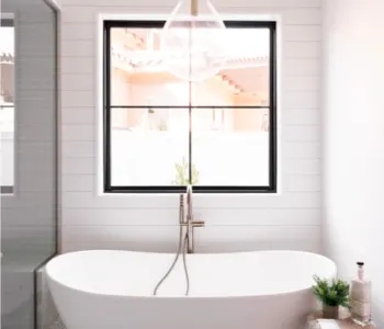 Bathtub with large window in the background; orange toolbelt icon