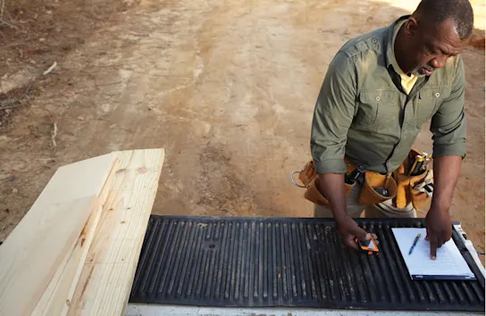 a construction worker reviewing a permit