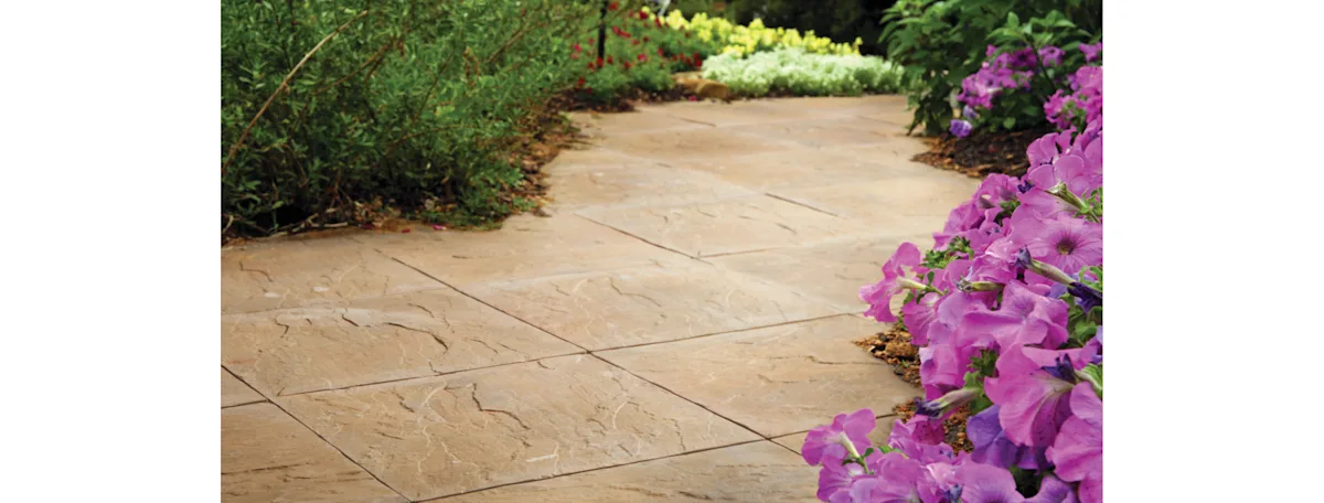 A tan, square slate tile walkway