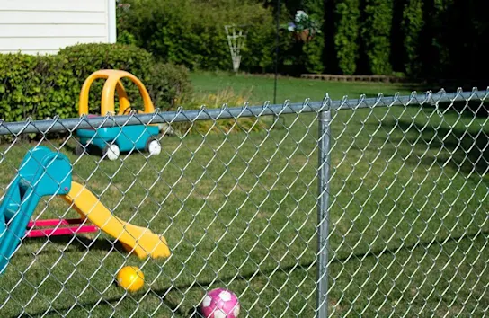 Chainlink fence around a family's yard