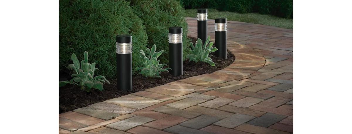A new brick walkway a nighttime lite by solar lights