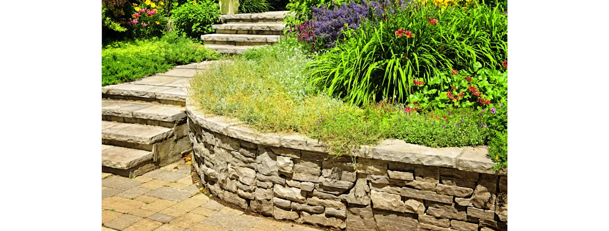 A stone retaining wall and stairway