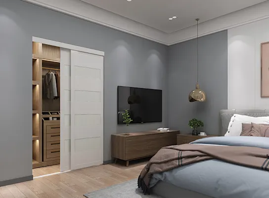 Modern bedroom with white bypass doors open showing the interior of the closet