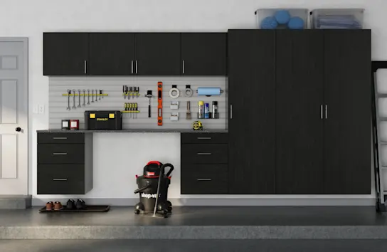 Ebony cabinets in a well organized garage