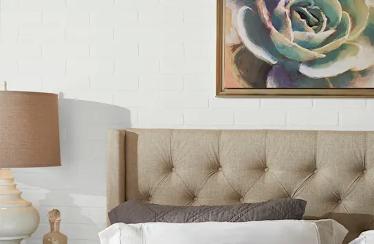 White satin painted brick wall in a bedroom
