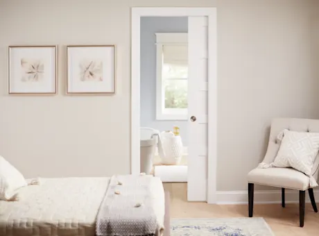 Pocket door open to full walk-in closet.