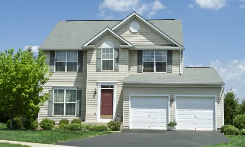 Large two story house with two garages; Orange door icon