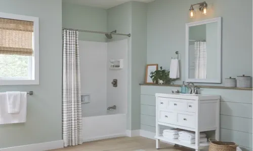 Mint colored bathroom; orange tag icon