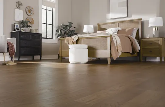 Large modern bedroom with hardwood flooring