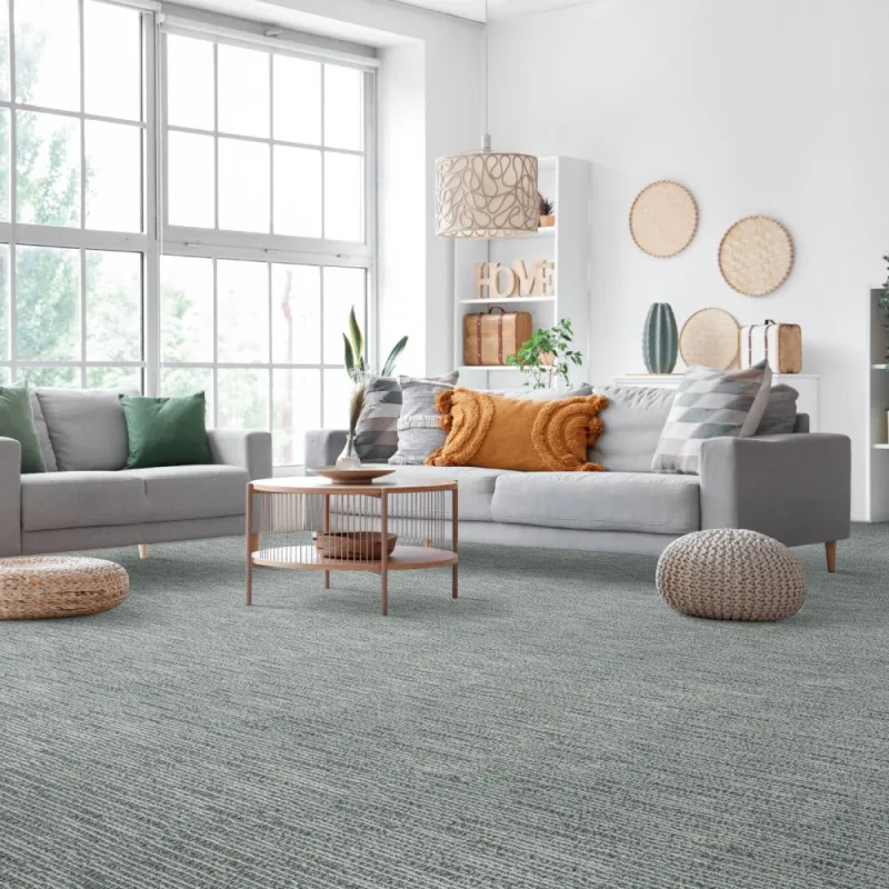 Bright and airy living room with blue carpet
