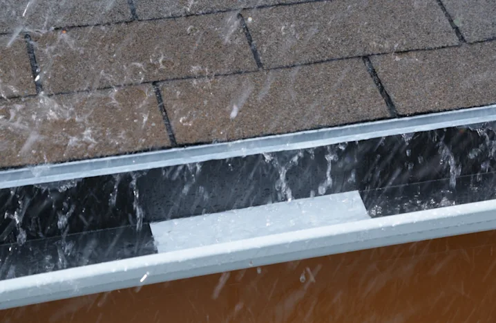 image of rain hitting gutters