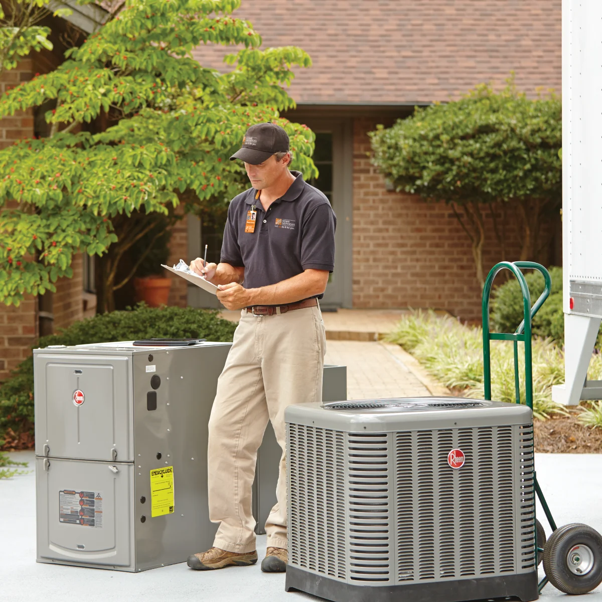 HD Service pro standing outside a customer's home to deliver an HVAC and furnace