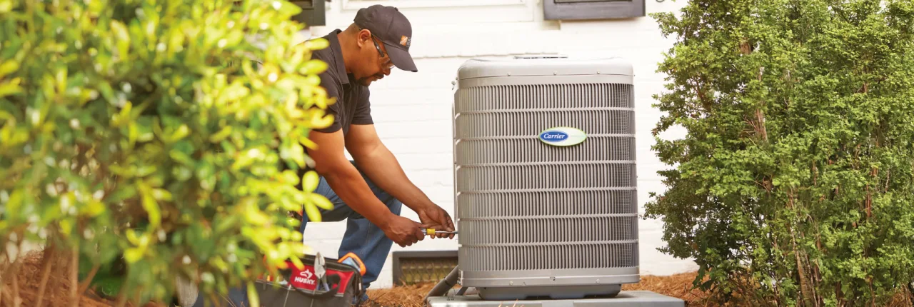 THD service provider repairing a customer's HVAC unit