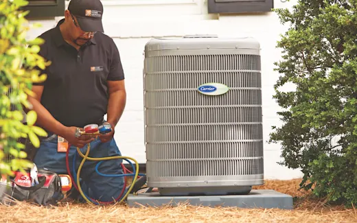 HVAC Service Provider repairing an HVAC condenser