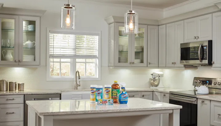 A beautiful clean traditional kitchen with cleaning products on the countertop