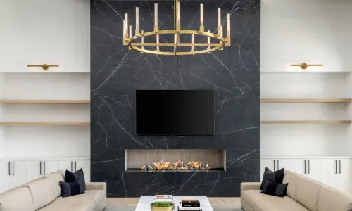 Large luxurious living room with a vertical porcelain fireplace surround; orange countertop icon