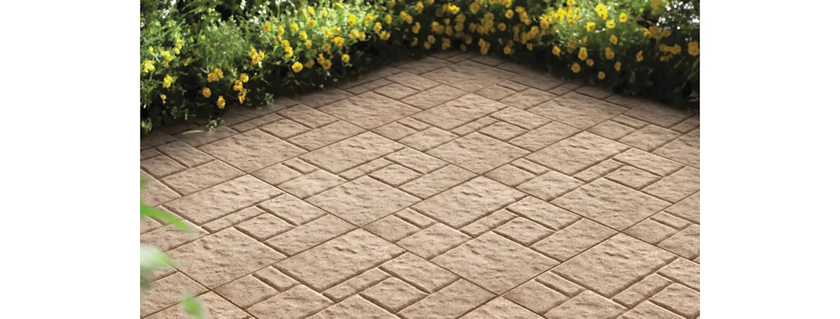 image of a paver patio in an asymmetrical square pattern and light brown color