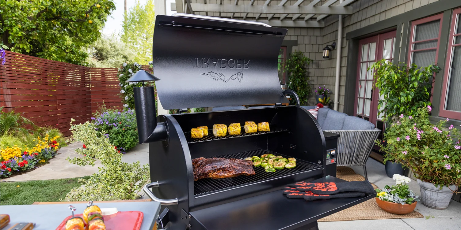 a bbq grill cooking vegetables and meat