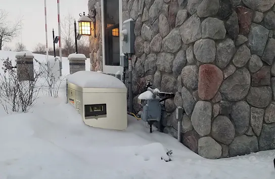 a natural gas meter on the side of a stone house