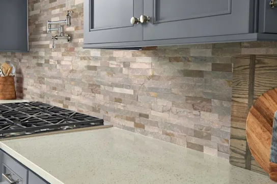 a natural stone kitchen backsplash