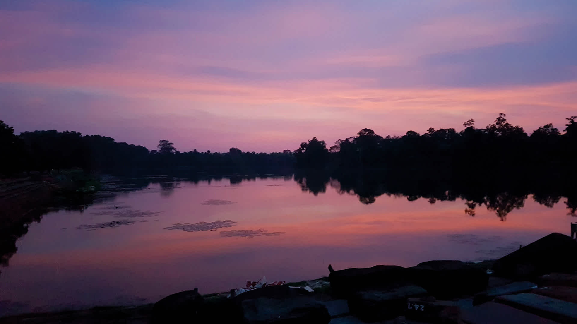 Red skys above the moat surrounding Angkor Wat
