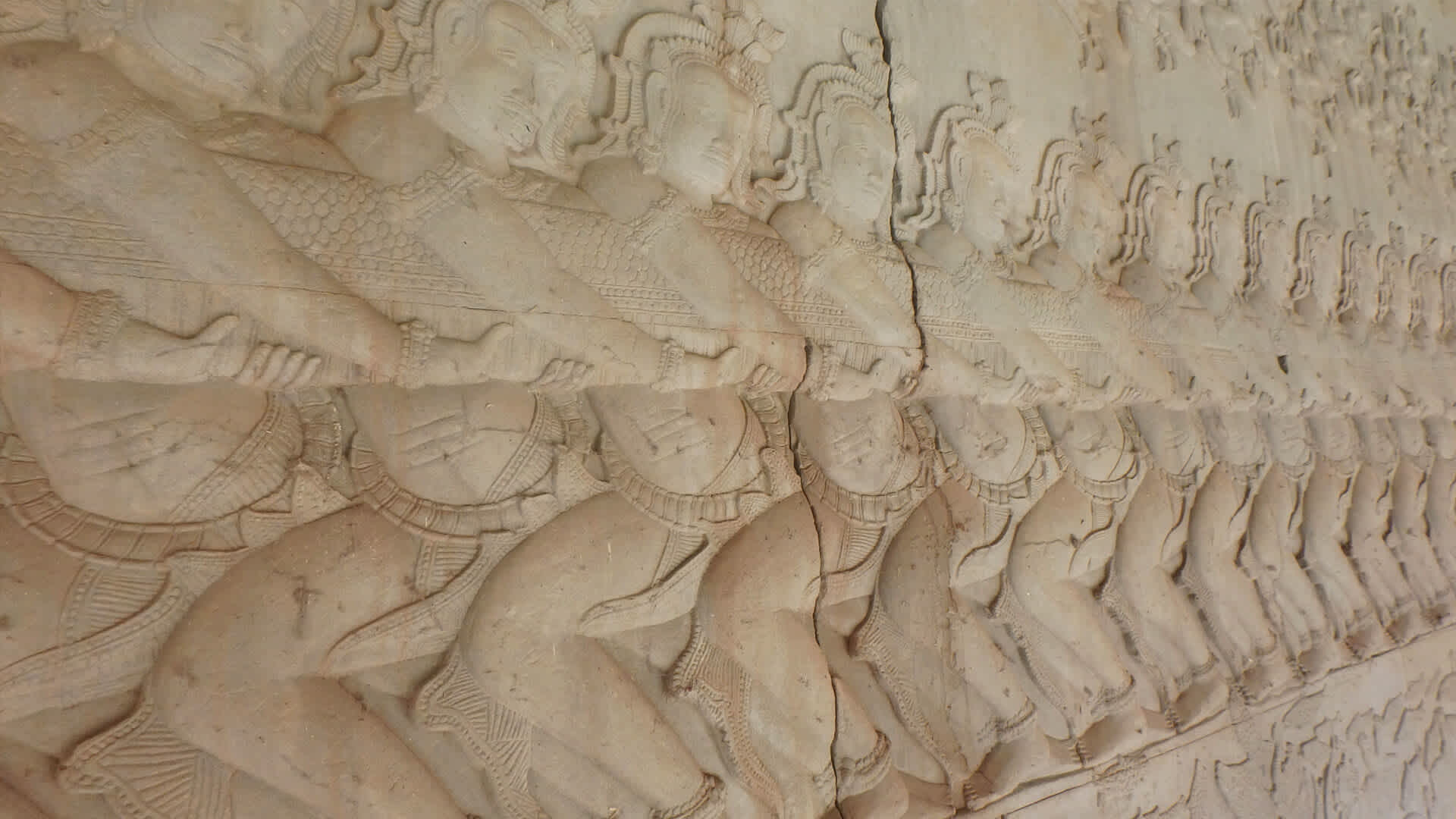 Detailed wall carvings within Angkor Wat.