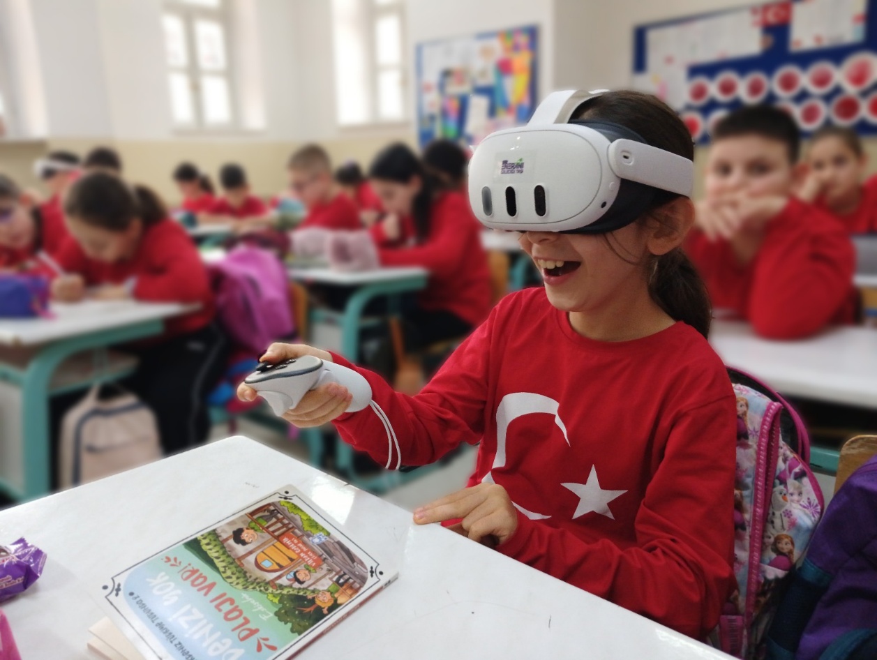 A pupil using the virtual reality module on energy saving and electrical safety during a classroom session.